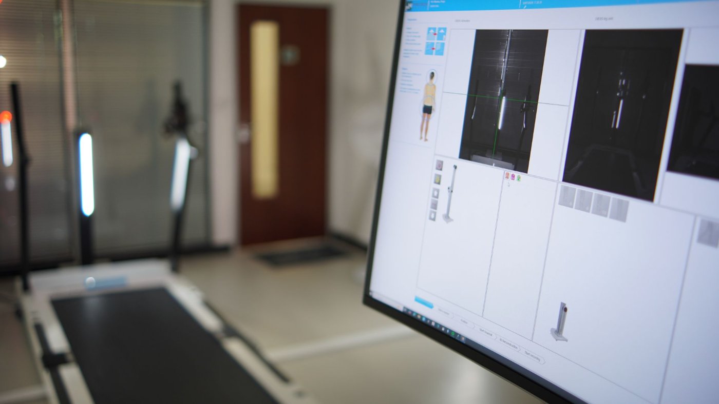 The DIERS assessment station — treadmill and gait-analysis monitor in the lab
